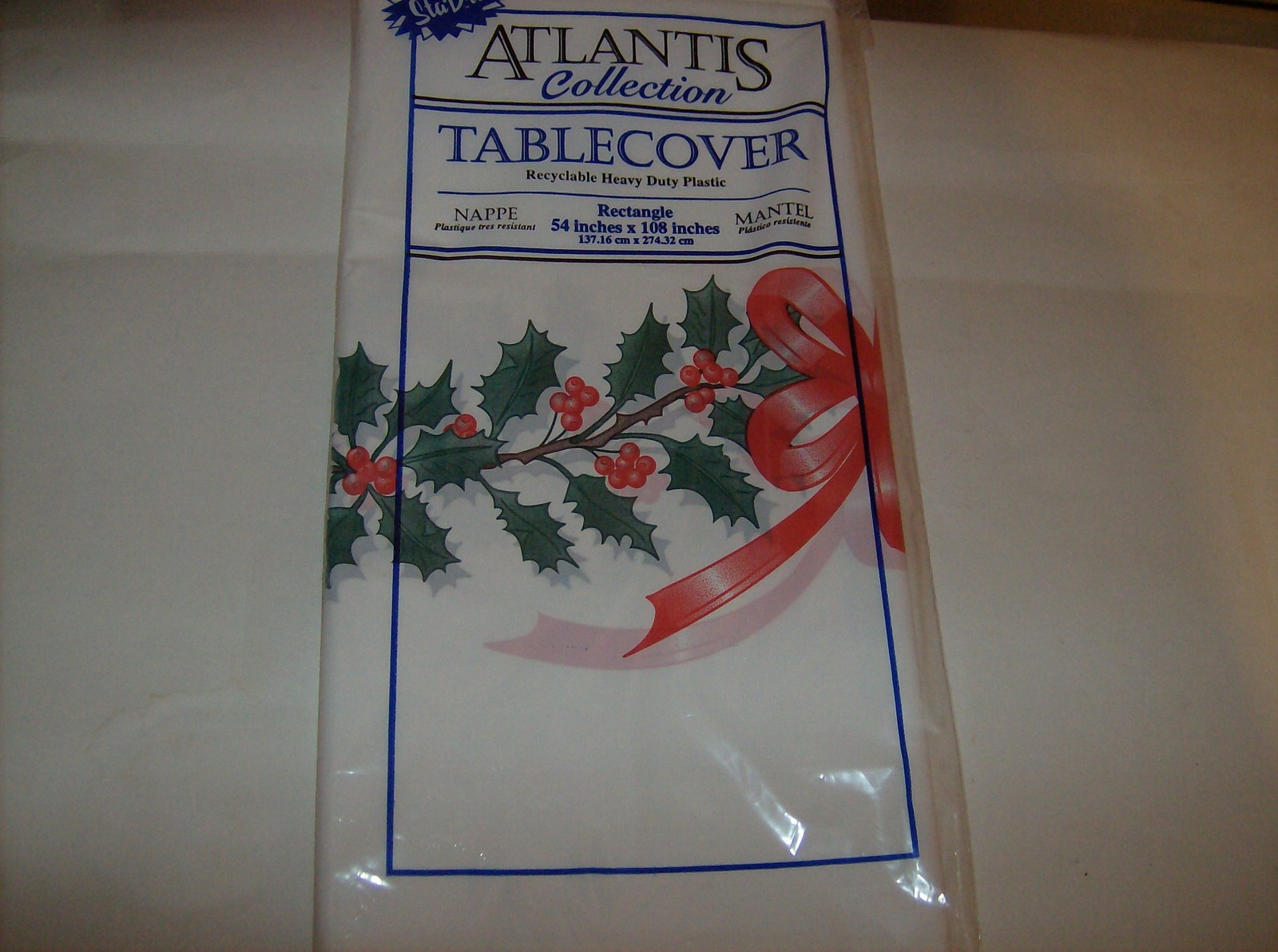 White Heavy Duty Plastic Rectangular 54 x 108 Inches Holly And Bows Tablecover