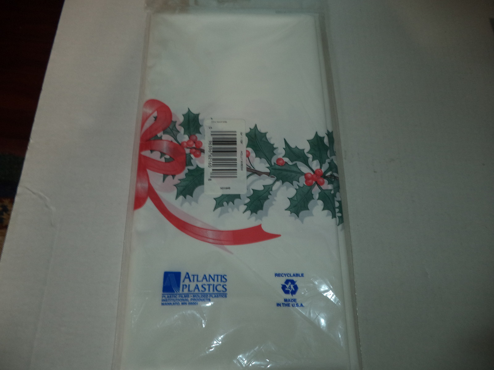 White Heavy Duty Plastic Rectangular 54 x 108 Inches Holly And Bows Tablecover