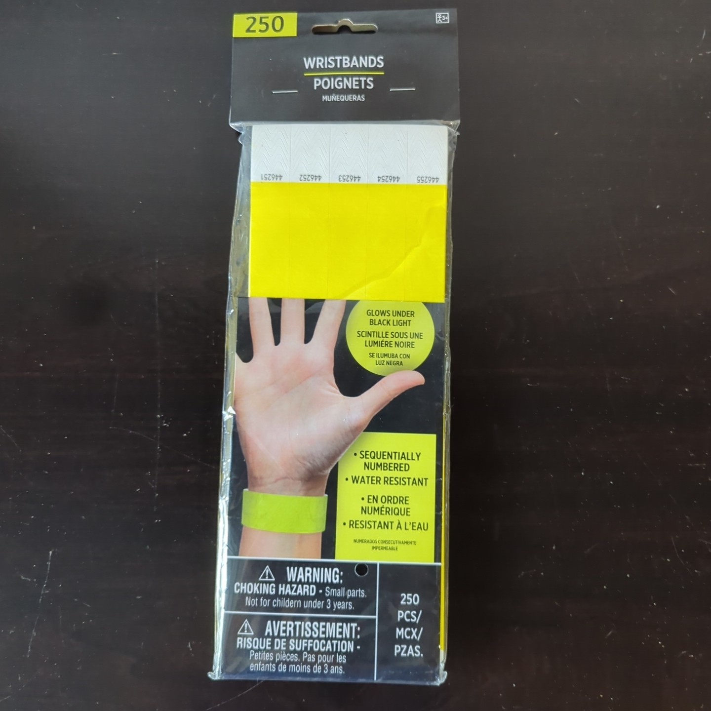 BRAND NEW AMSCAN WRISTBANDS YELLOW, 250 COUNT, GLOWS UNDER BLACK LIGHT