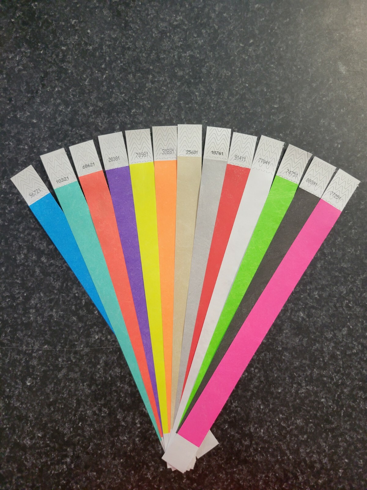 130 3/4″ ASSORTED TYVEK WRISTBANDS, 10 EACH OF 13 COLORS. PAPER WRISTBANDS