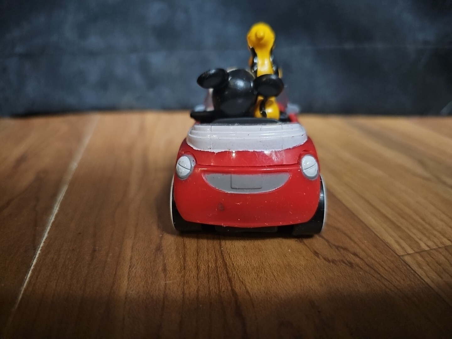 DecoPac Disney’s Mickey Mouse and Pluto in Rolling Red Car Cake Topper 3 1/4″ L